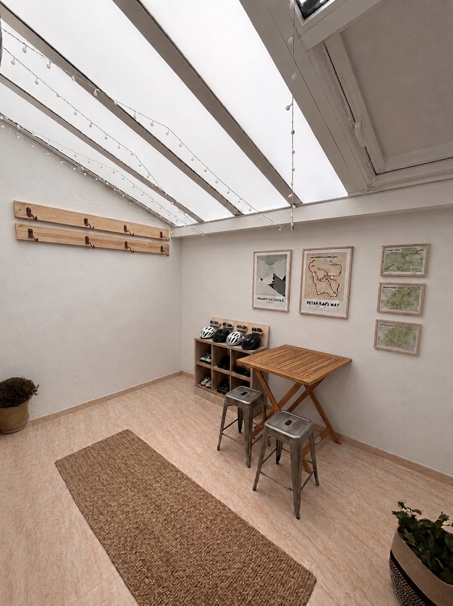 The bike room — wall racks, helmet storage and route maps